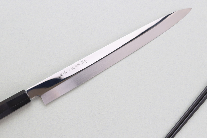 33-cm Sakai Takayuki BS2 Fuguhiki knife with mirror-polished honyaki blade in ebony and a black magnolia saya
