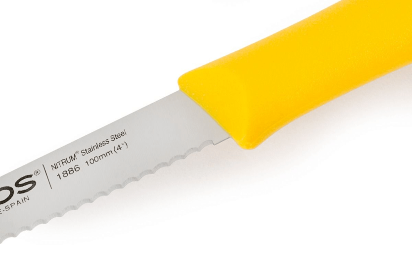 Arcos Nova skjærekniv med takket blad i Nitrum-stål, 10 cm, gult skaft