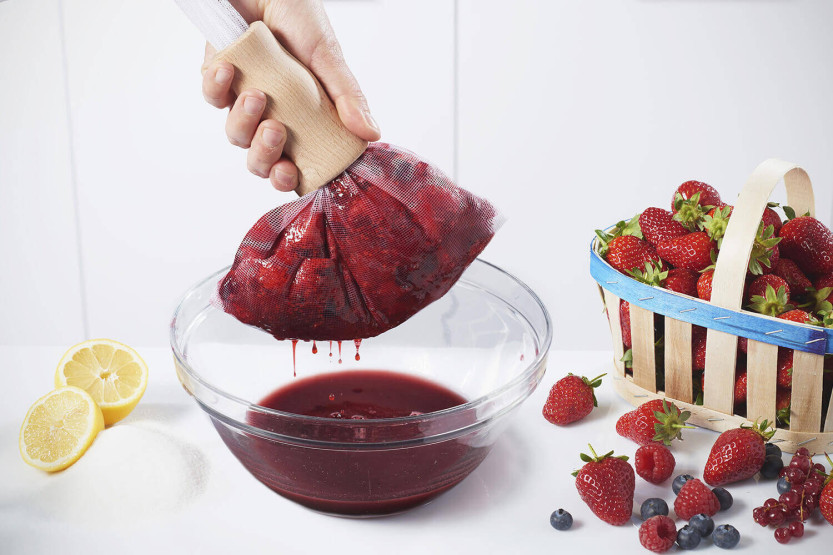 Prensa de nylon para frutas y empujador de madera