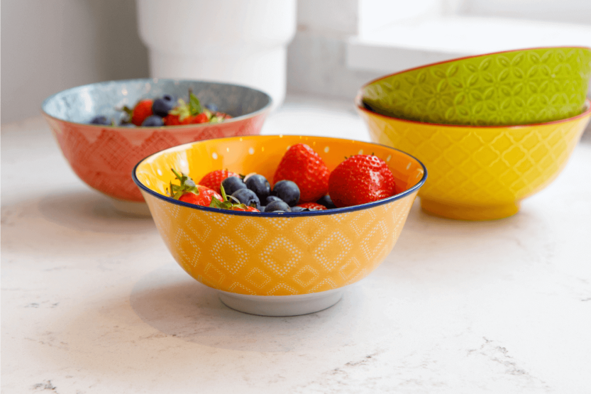 KitchenCraft glazed stoneware bowl, yellow and red floral motif
