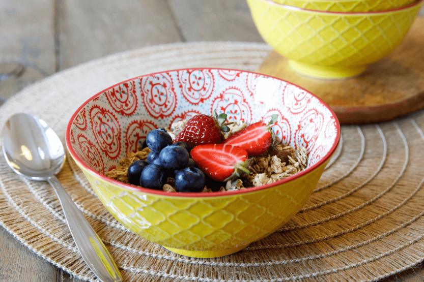 KitchenCraft glazed stoneware bowl, yellow and red floral motif