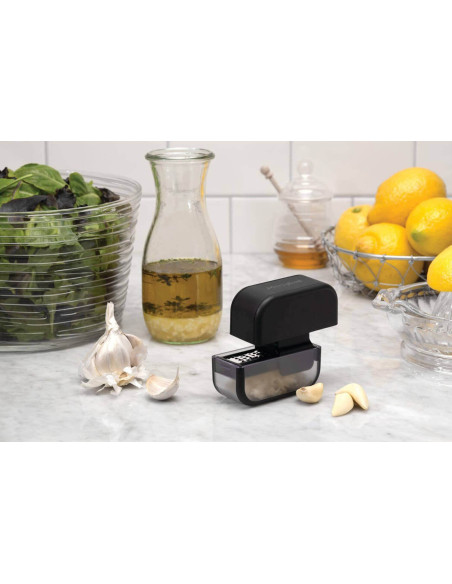 Black Microplane garlic cutter with scraper